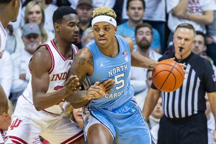 North Carolina Tar Heels forward Armando Bacot (5) dribblesIndiana Hoosiers forward Jordan Geronimo (22) the ball while defends in the first half at Simon Skjodt Assembly Hall.